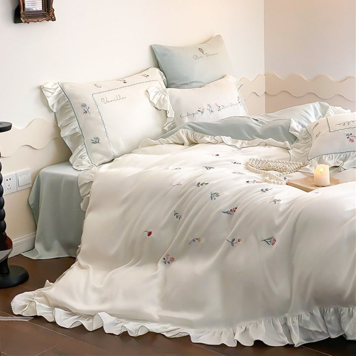 Romantic cotton satin bedding set with delicate floral embroidery and ruffle trim