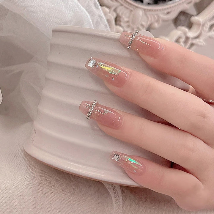 Acrylic nail set with glamorous rhinestone and glitter elements Kalsten