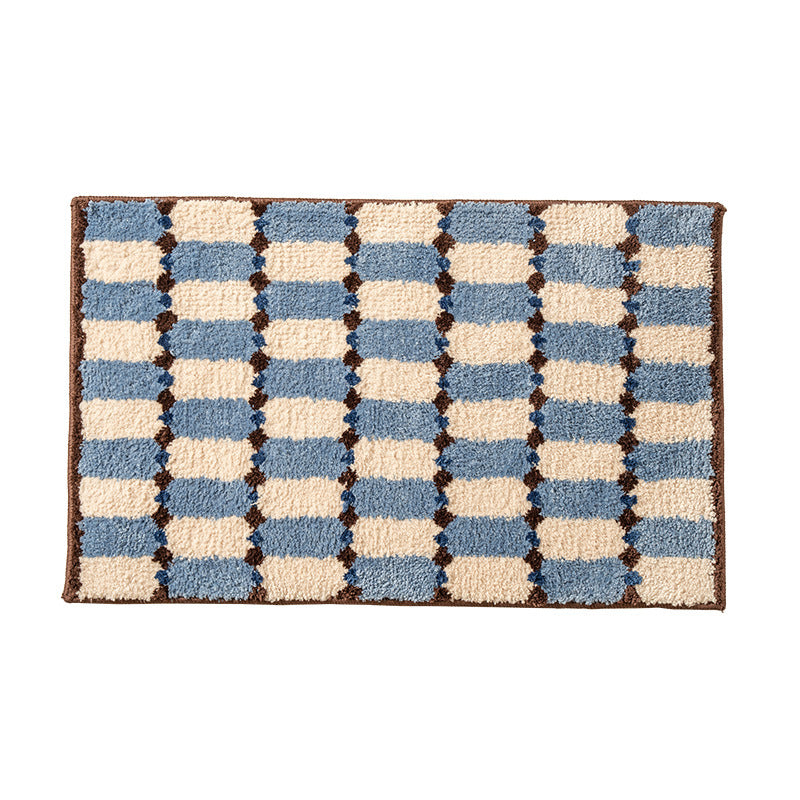Hand-tufted bathroom mat with a velvety pile, non-slip latex backing, and geometric honeycomb check pattern Kalsten