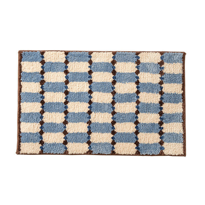 Hand-tufted bathroom mat with a velvety pile, non-slip latex backing, and geometric honeycomb check pattern Kalsten
