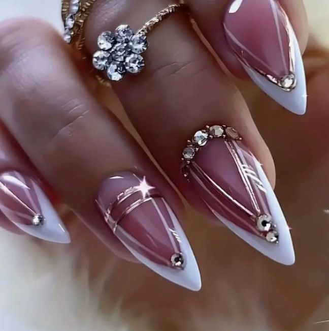 Acrylic nail set with elegant stiletto shape and luxurious embellishments Kalsten