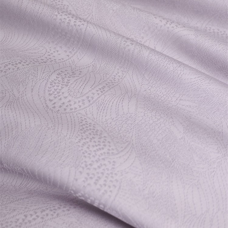 Premium duvet cover set with subtle jacquard structure and decorative ribbon Kalsten