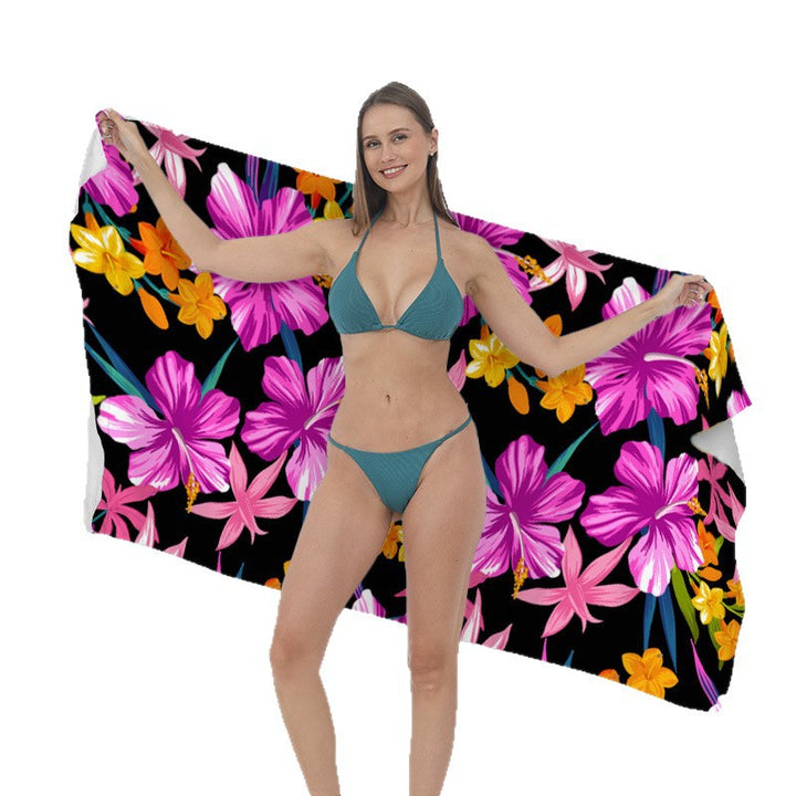Beach towel with vibrant tropical plant motif Kalsten