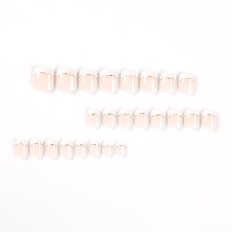 Artful nail extensions with elegant French tip and gold accents Kalsten