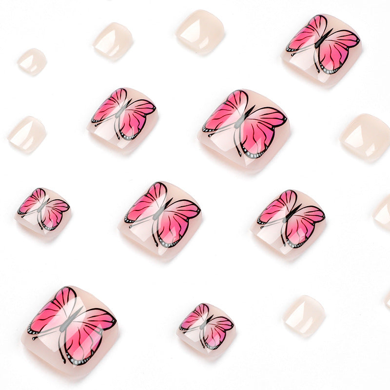 Artful toenail design with butterfly design Kalsten