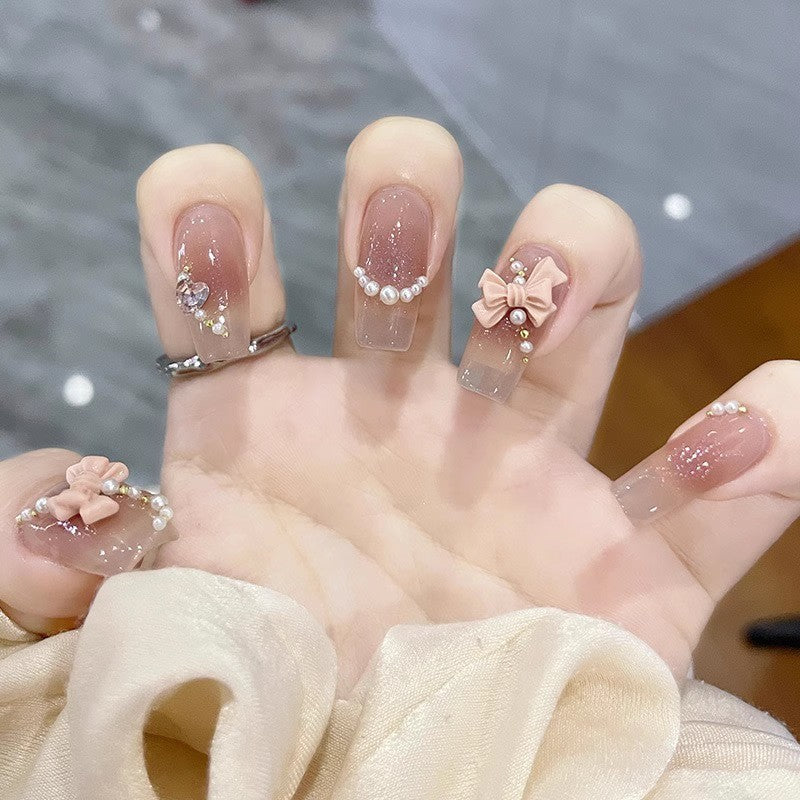 Glamorous artificial nails with moon and star motifs Kalsten