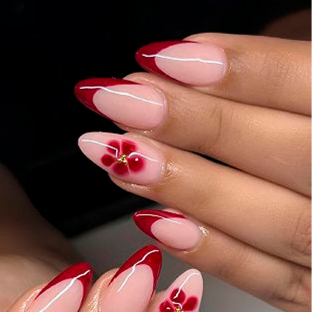 Elegant and artistically designed stiletto nails with flower design Kalsten