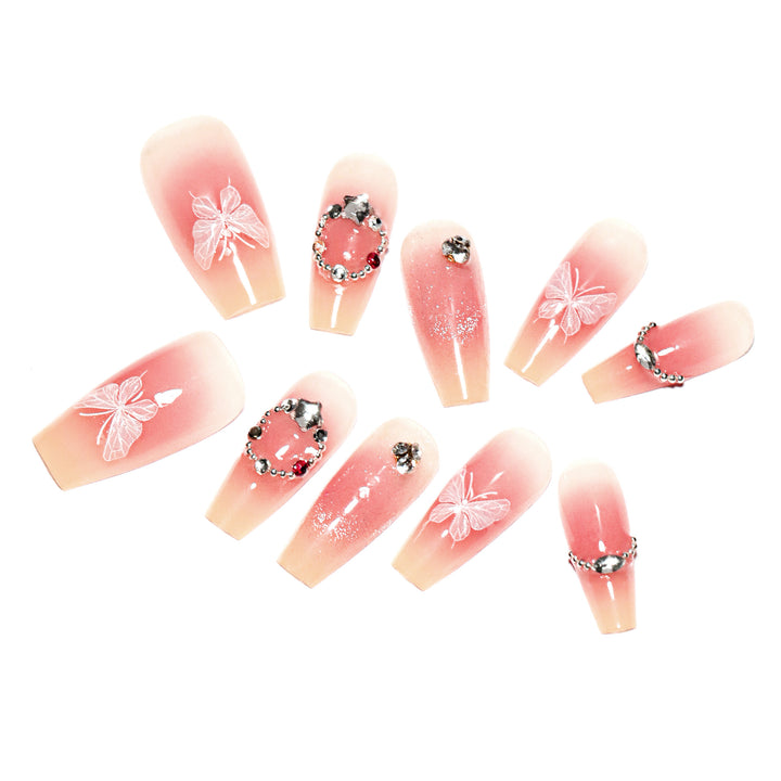 Artificial nail extensions with floral design and sparkling accents Kalsten