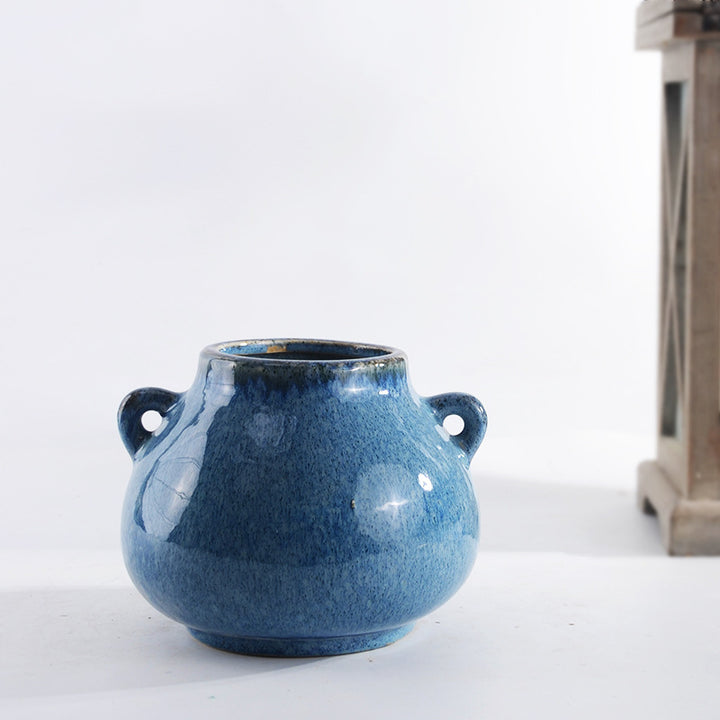 Decorative ceramic pot with playful handles Kalsten