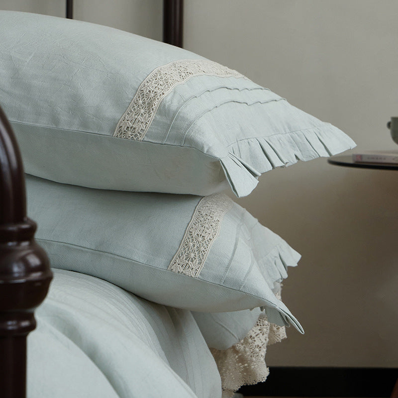 High-quality linen bedding set with handcrafted crochet lace, box pleats, and integrated bed skirt