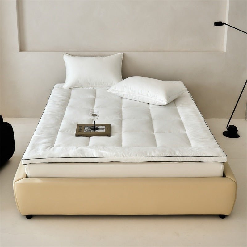 Padded mattress topper made of quilted microfiber and cotton comfort