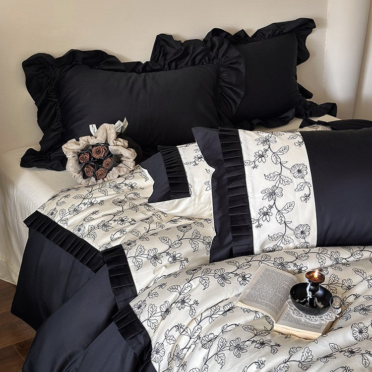 Elegant reversible bedding set made of fine satin with botanical contour print and pleated border