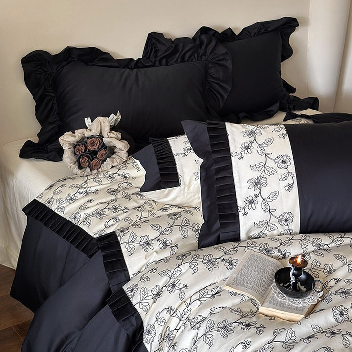 Elegant reversible bedding set made of fine satin with botanical contour print and pleated border