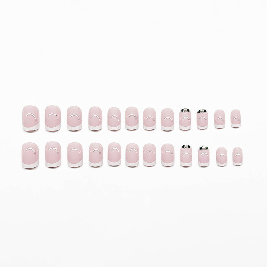 Art nail set with elegant French design and glittering accents Kalsten
