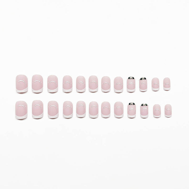 Art nail set with elegant French design and glittering accents Kalsten
