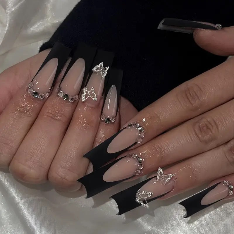Trendy artificial nails with delicate rhinestone and butterfly accents Kalsten