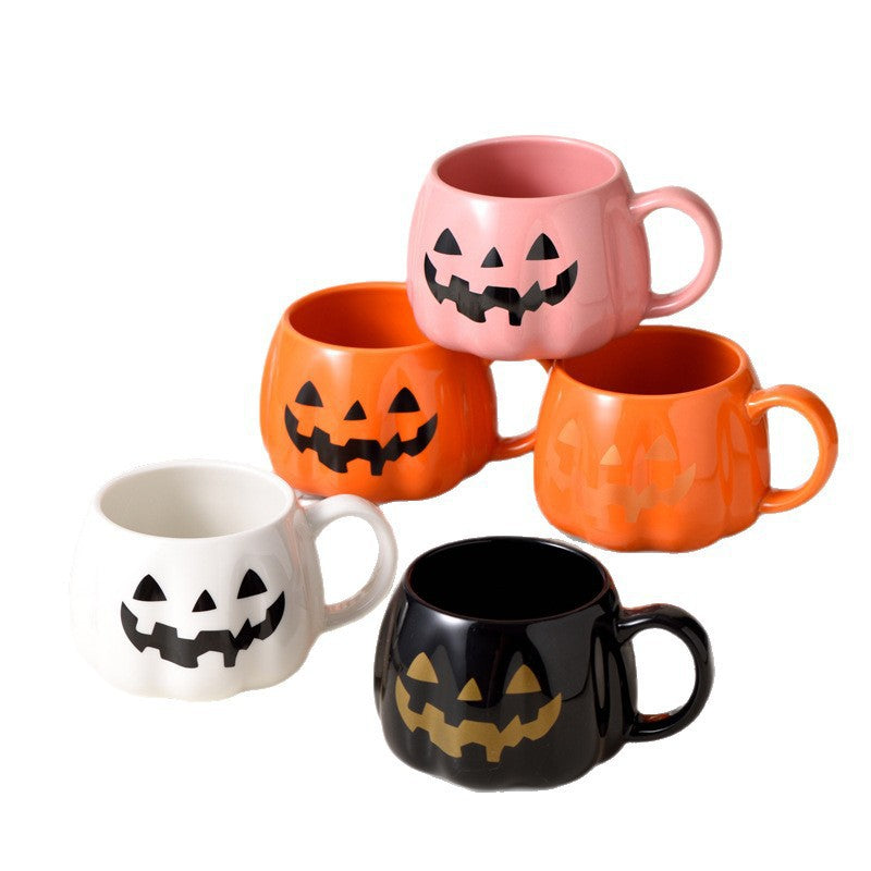 Ceramic mug in pumpkin shape with handle and carved face