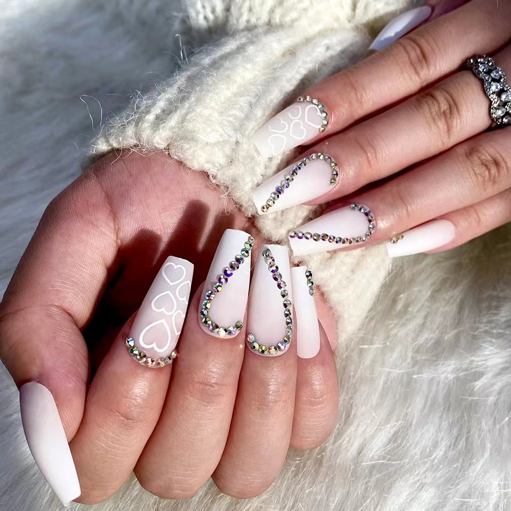 Artful Nail Extensions with Heart Design and Glitter Accents Kalsten