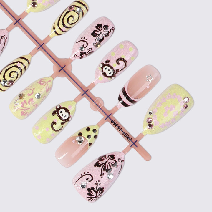 Creative nail art set with playful monkey designs and glitter details Kalsten