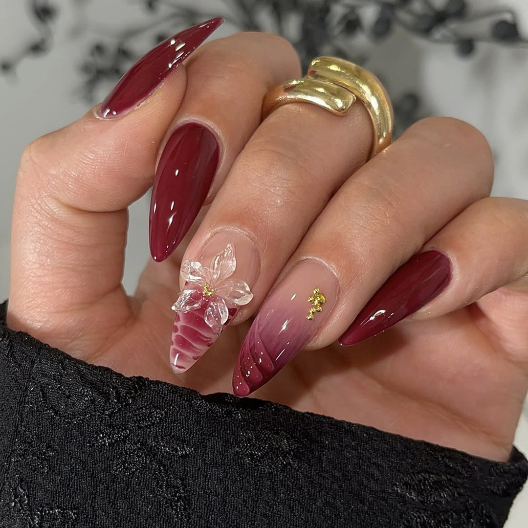 Artificial nail set with modern stiletto design and impressive flower appliqué Kalsten