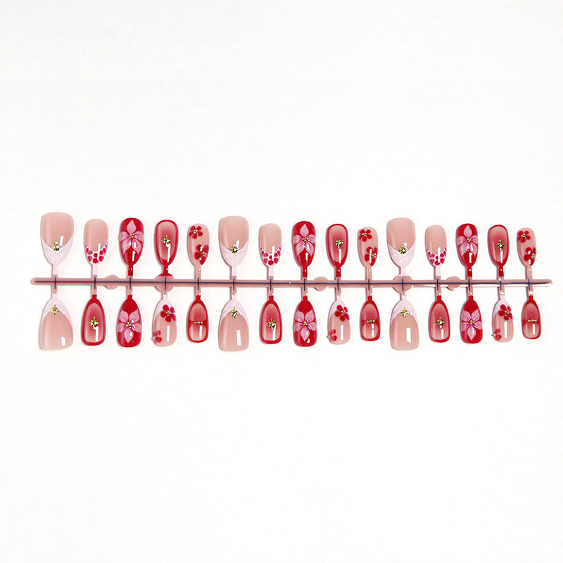 Artificial nails with floral design and glamorous accents Kalsten