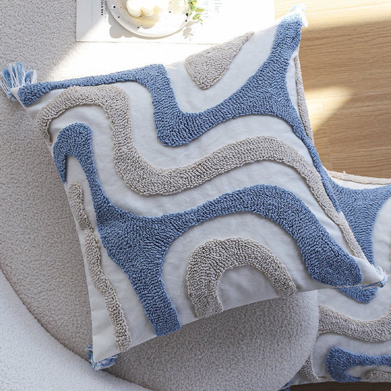 Square cushion cover with relief hand-tufted wave structure made of cotton-linen blend and decorative corner tassels Kalsten