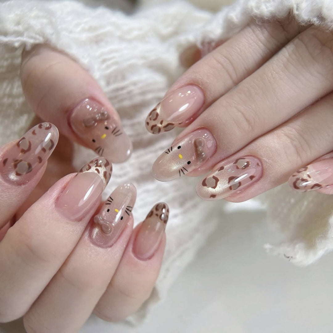 Creative Nail Art with Cute Cat Motif and Glitter Accents Kalsten