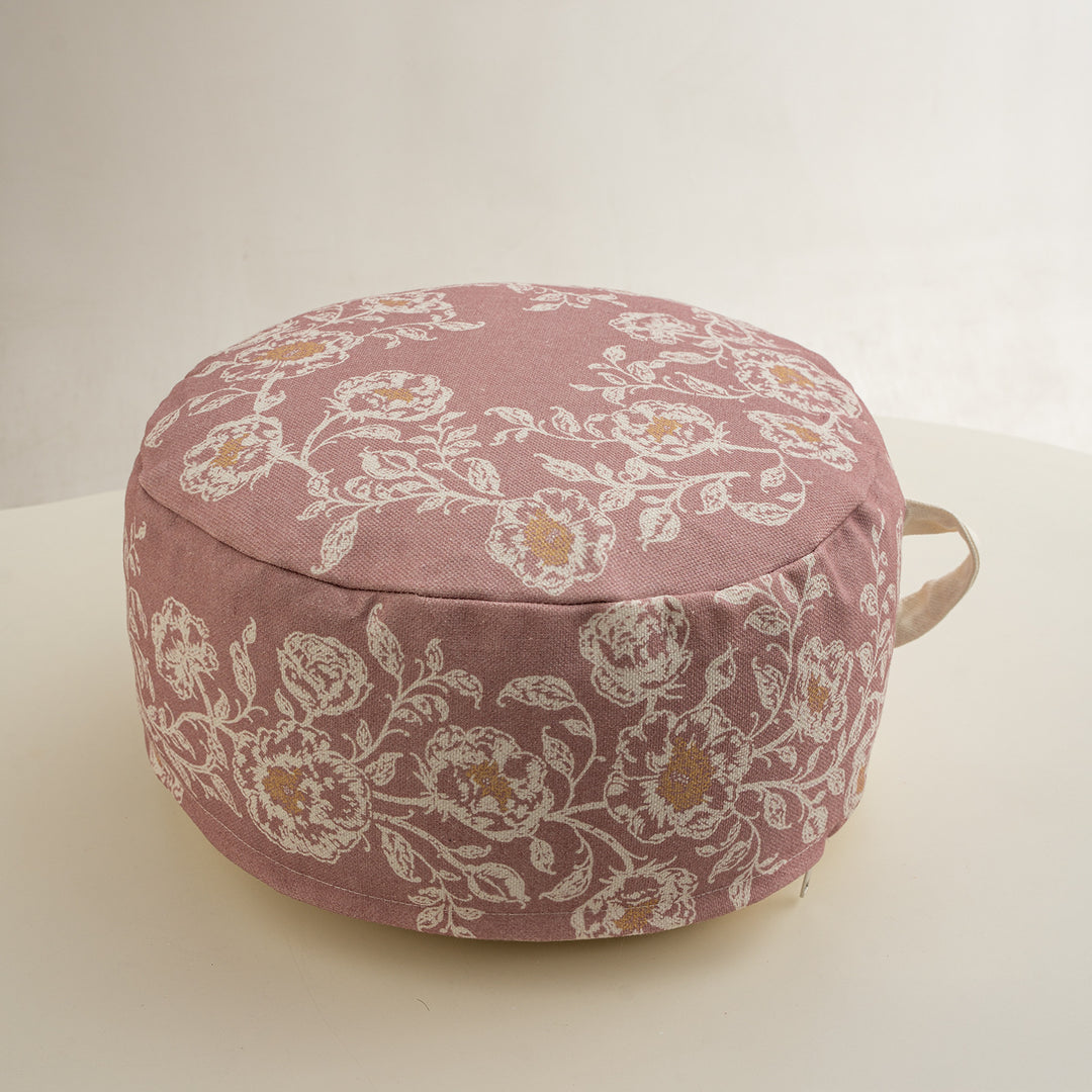 Round seat pouf with floral jacquard weave, stable upholstery core, and carrying handle Kalsten