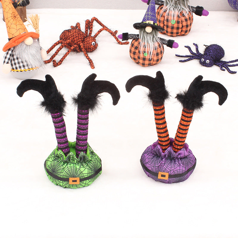 Skurrile Halloween table figure with standing witch legs and spider web sack
