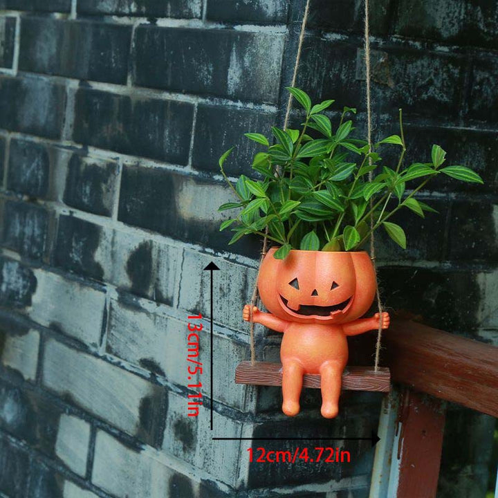 Hanging ceramic pumpkin flower pot with carved pumpkin face and jute string