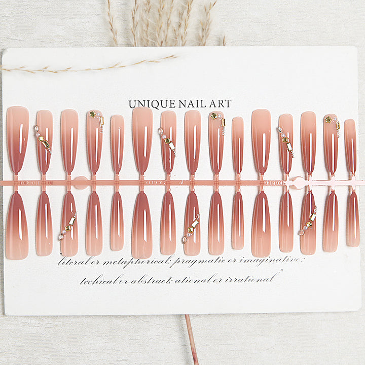 Artificial nail set with elegant ombre effect and glamorous embellishments Kalsten