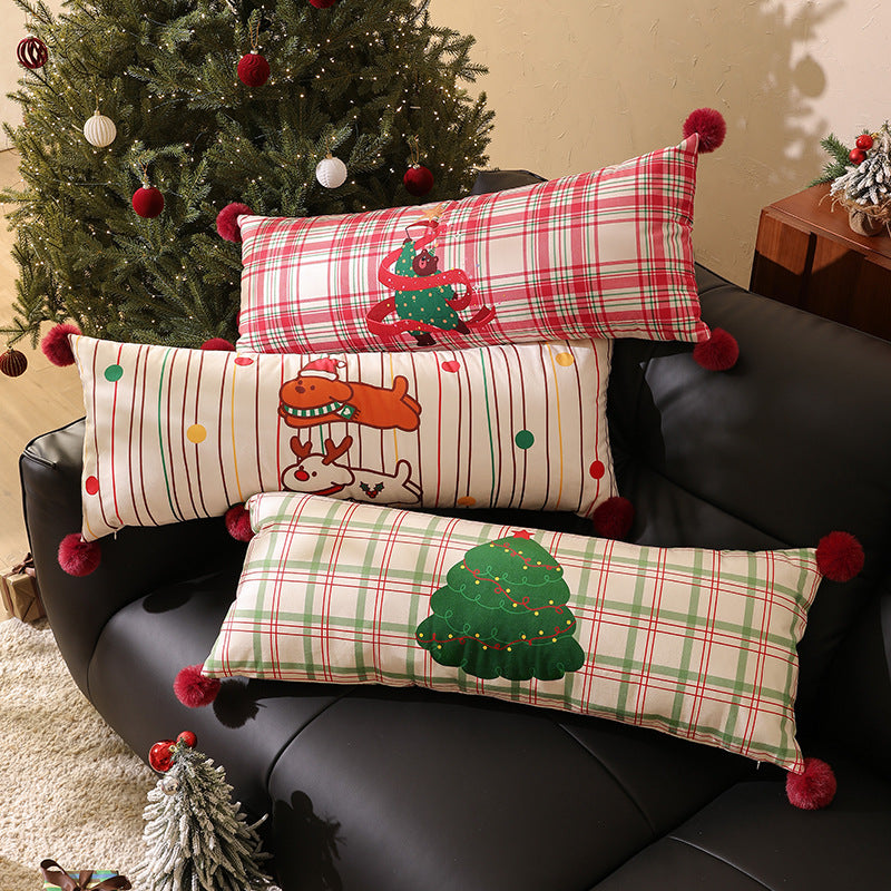 Long decorative lumbar and neck pillow in Christmas check with pompom and dog-tree motif Kalsten