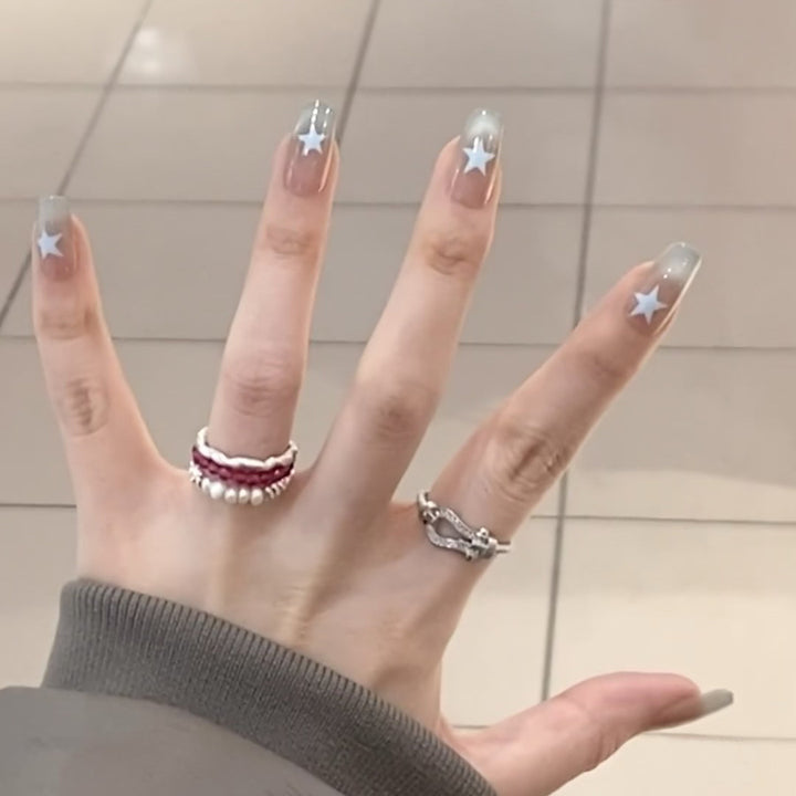 Artificial fingernails with star motif and ombre effect Kalsten