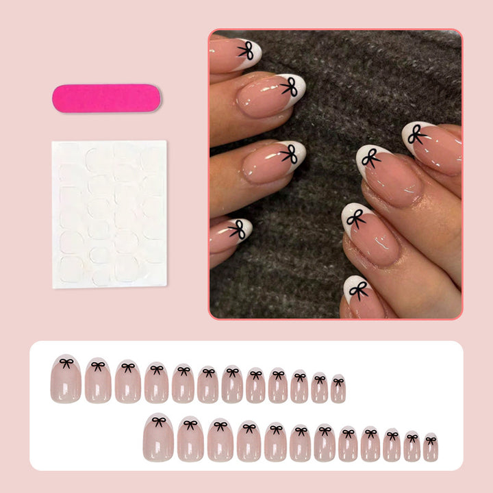 Acrylic nail set with playful bow design Kalsten