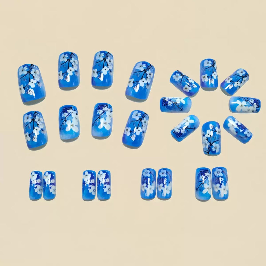 Artificial nail set with floral designs and glitter accents Kalsten