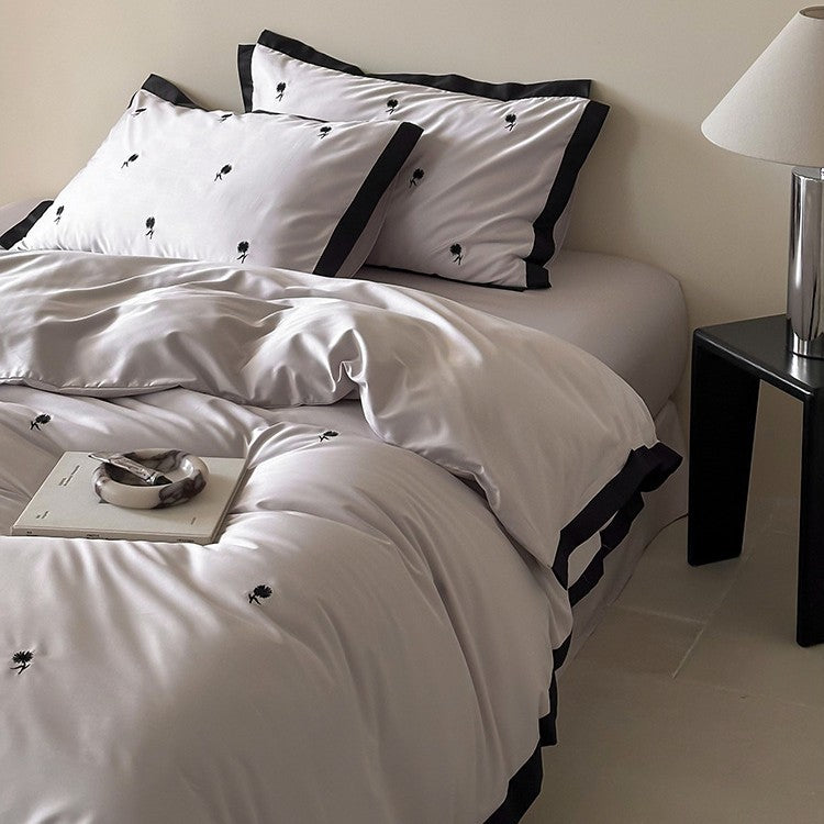 Luxurious satin bedding set with cherry embroidery and contrasting trim