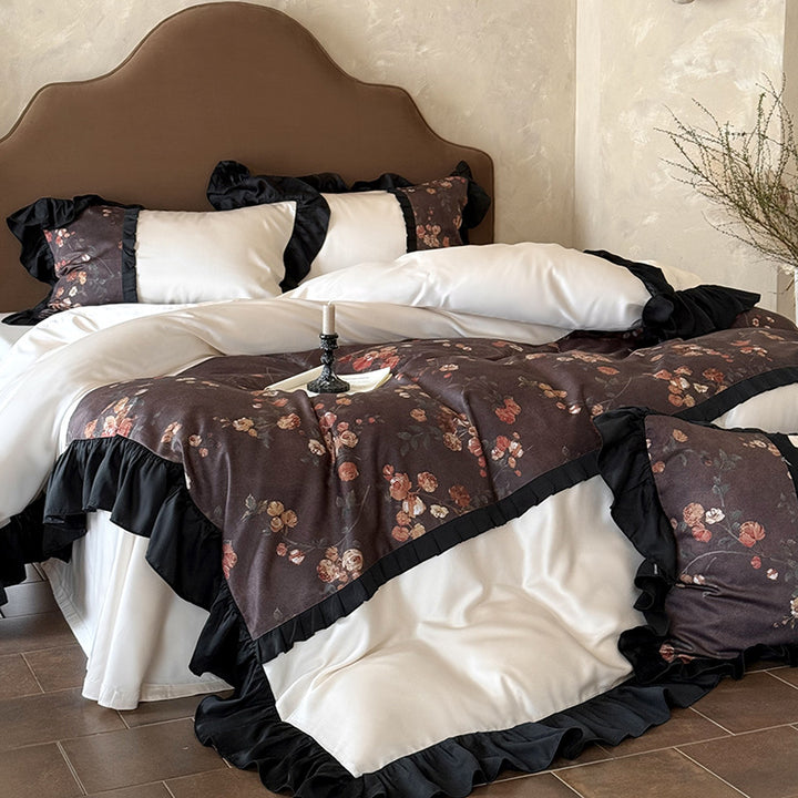 Reversible cotton satin bedding set with floral design and decorative ruffle trim