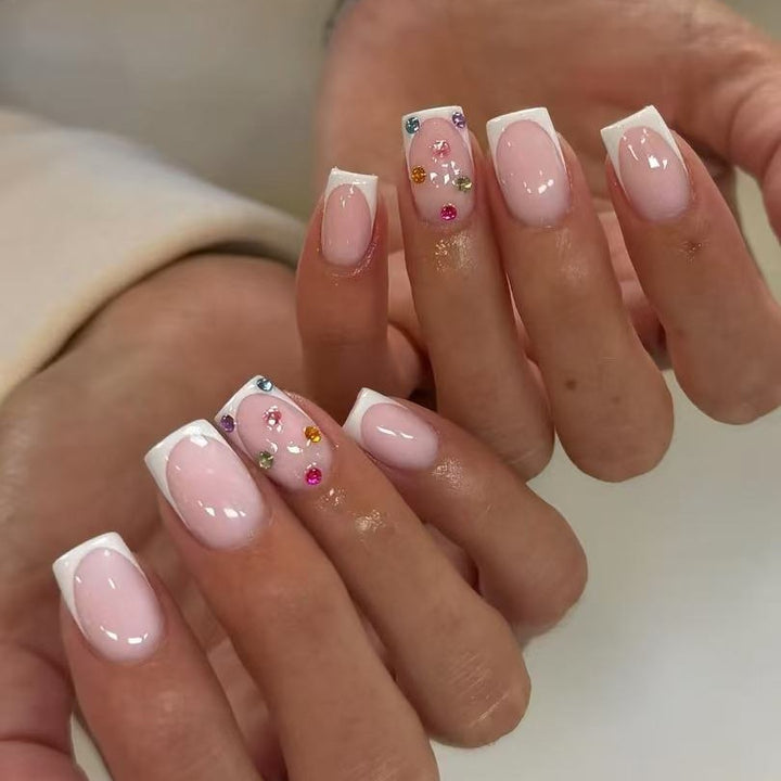 Nail art set with elegant French tips and sparkling rhinestone embellishments Kalsten