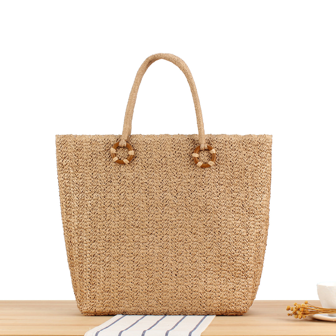 Beach bag made of natural woven material with sturdy carry handles Kalsten
