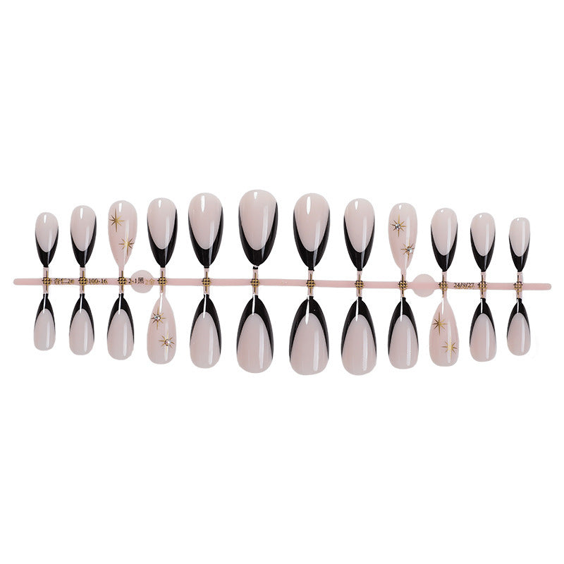 Artificial nail set with elegant black-and-white design and golden star accents Kalsten