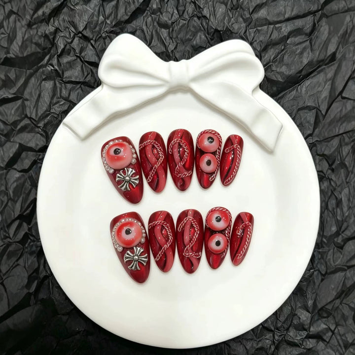 Artistic Press-On Nail Art Set with Unique Red Designs