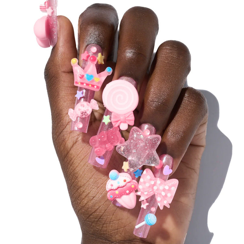 Creative nail art set with playful designs and glitter accents Kalsten