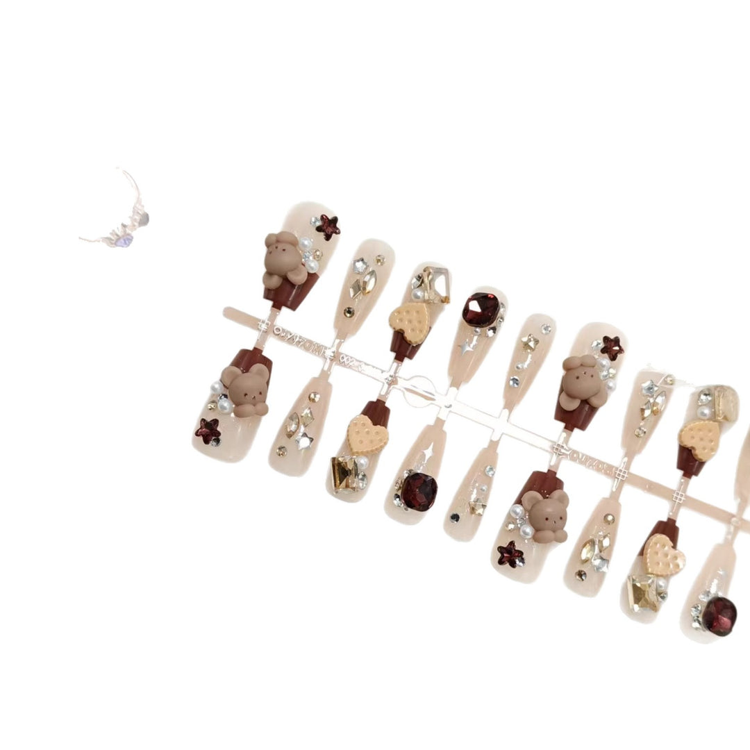 Creative acrylic nails with animal motifs and glitter accents Kalsten