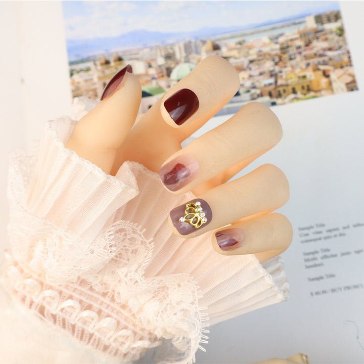 Decorative Press-On Nail Set with Elegant Crown Accents