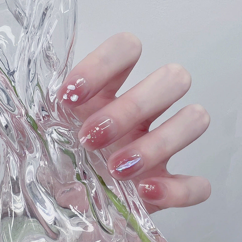 Artificial nails with delicate glitter design and floral accent Kalsten