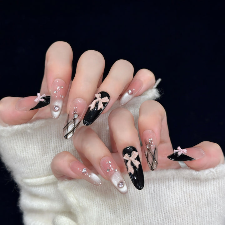 Artificial nail tips with elegant bows and glitter details Kalsten
