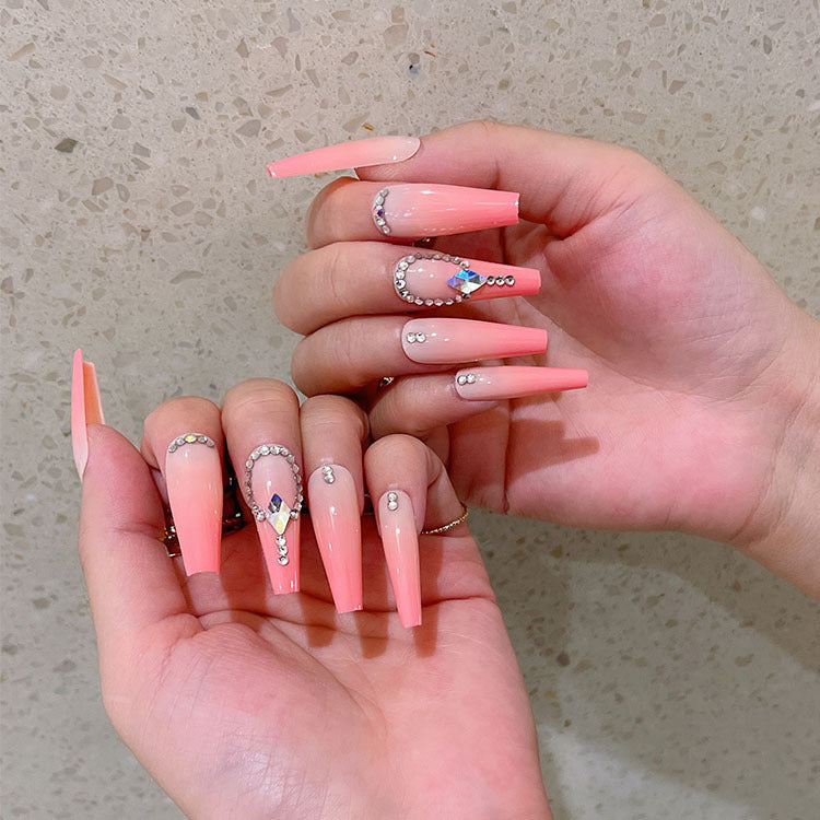 Artificial nails with glitter and stone embellishments Kalsten