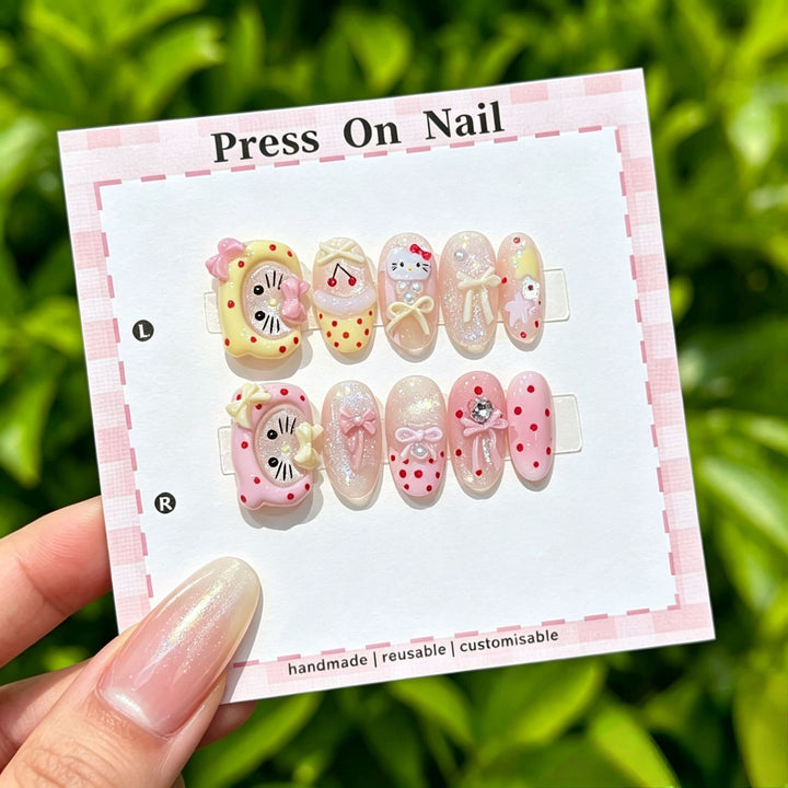 Artistic Press-On Nail Art Set with Cute Character and Bow Accents