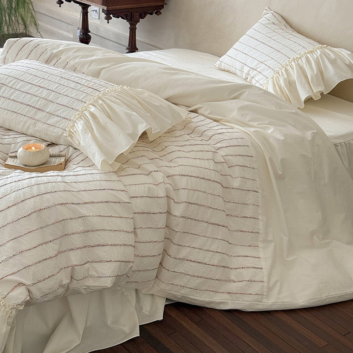 Bedding set made of cotton percale with striped relief embroidery and ruffled bed skirt