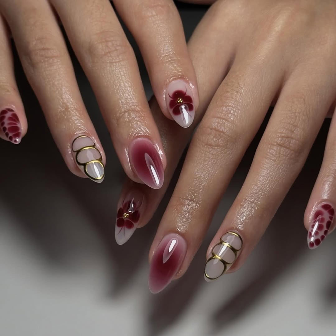 Elegant Nail Art with Floral Design and Glitter Accents Kalsten